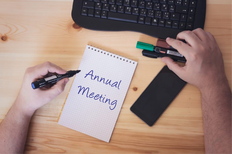 Conceptual hand writing showing Annual Meeting